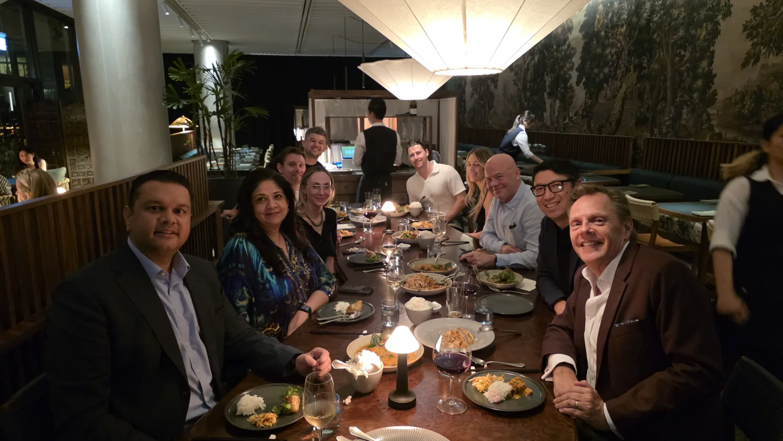 Sydney Members' Dinner — a long communal table of ten Flights Club members sharing dinner at a Sydney restaurant.
