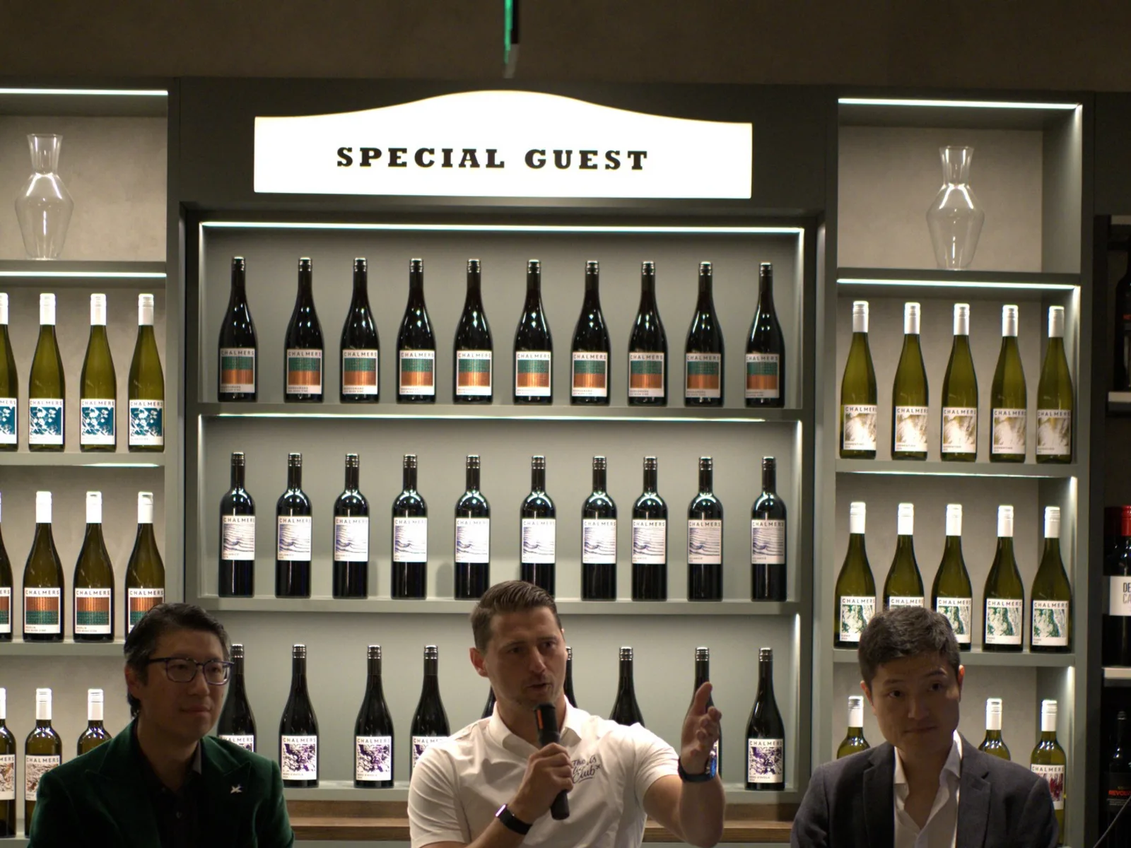 Melbourne Roadshow — three panelists at a wine wall under a 'Special Guest' sign during a Flights Club event.