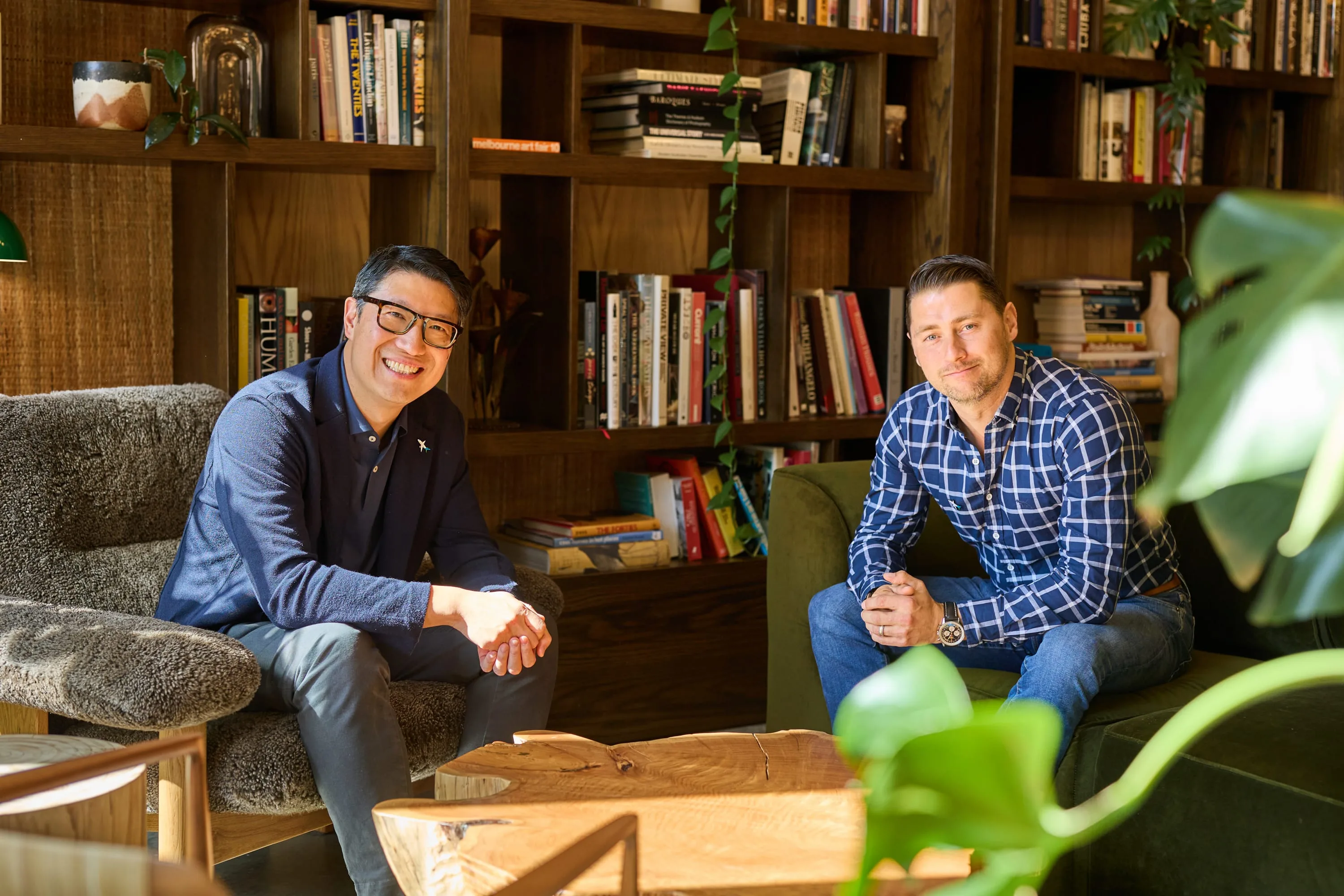 Steve Hui (left) and Steve Pirie-Nally (right), Co-Founders of The Flights Club, in a warm library setting.