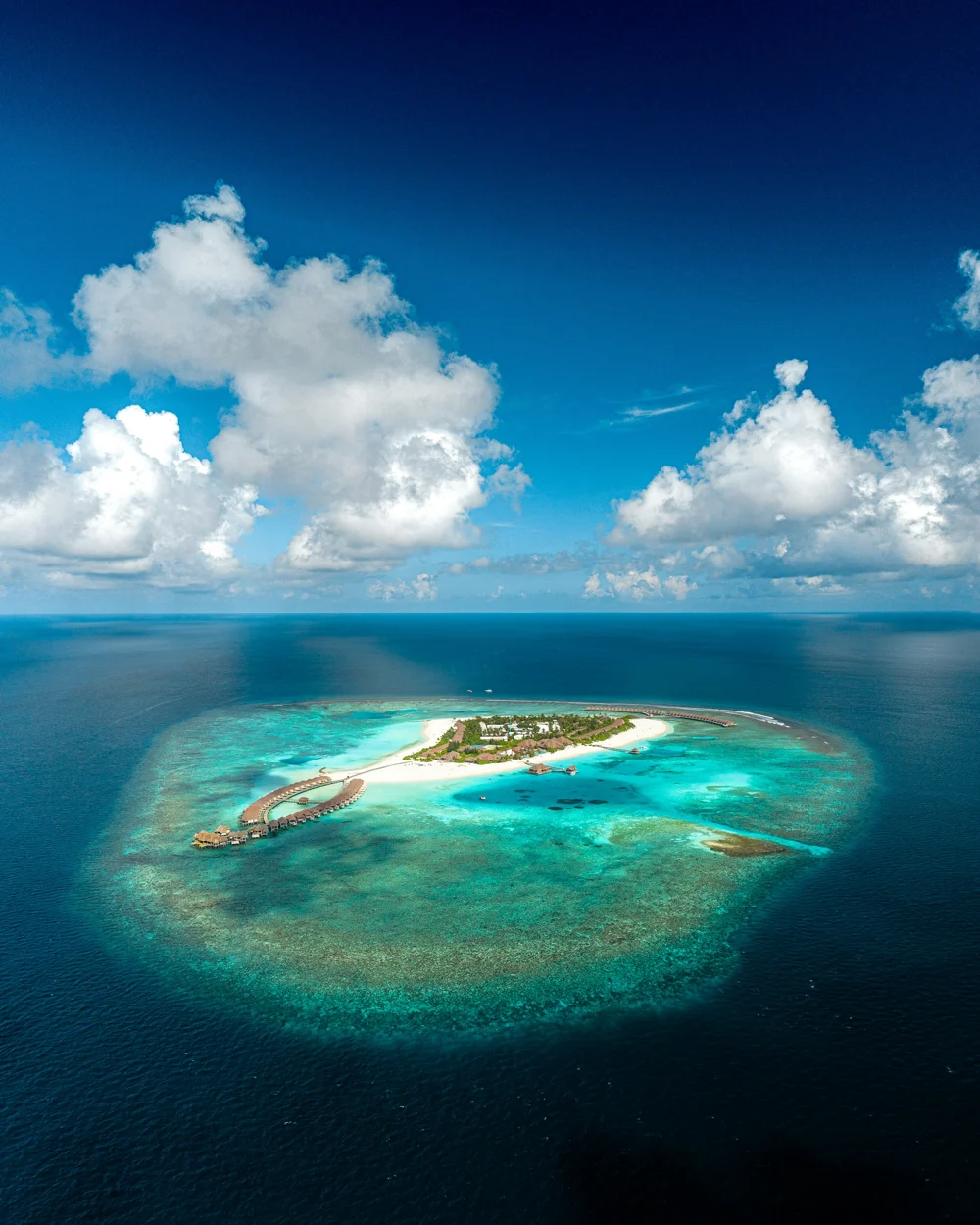 A secluded Maldivian island fringed with white sand and turquoise water